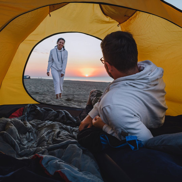 man in a tent ready to sleep man in a tent ready to sleep